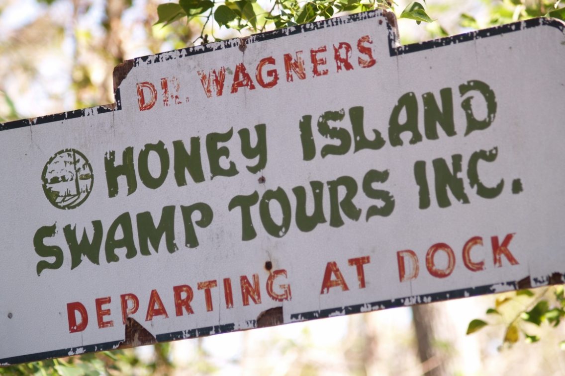A sign for Dr Wagner's Honey Island Swamp Tours.